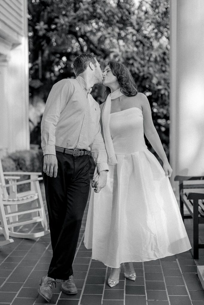 Fun-loving Fairview Inn Engagement Session in Mississippi by Lindsay Ott Photography.  Engaged couple walking shot, black & white photo.