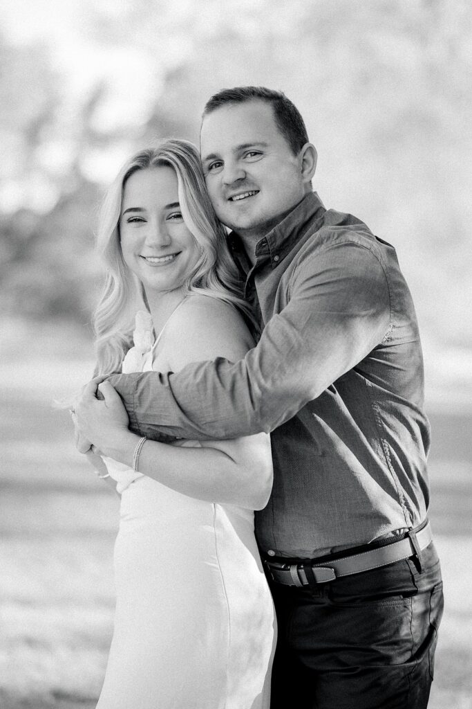 Livingston Chapel engagement session bride & groom cuddled up together